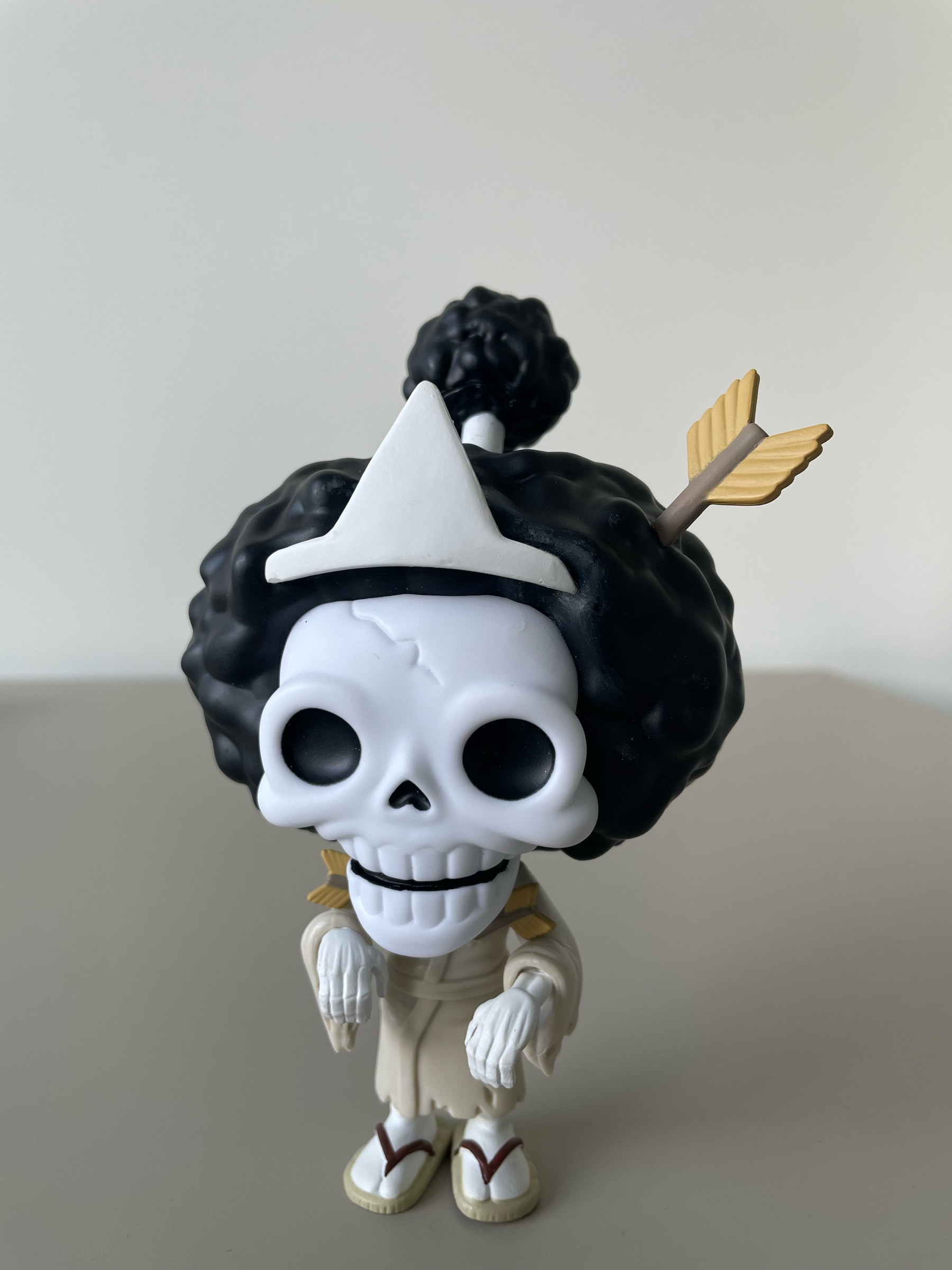 A Brook Funko Pop from One Piece on the desk
